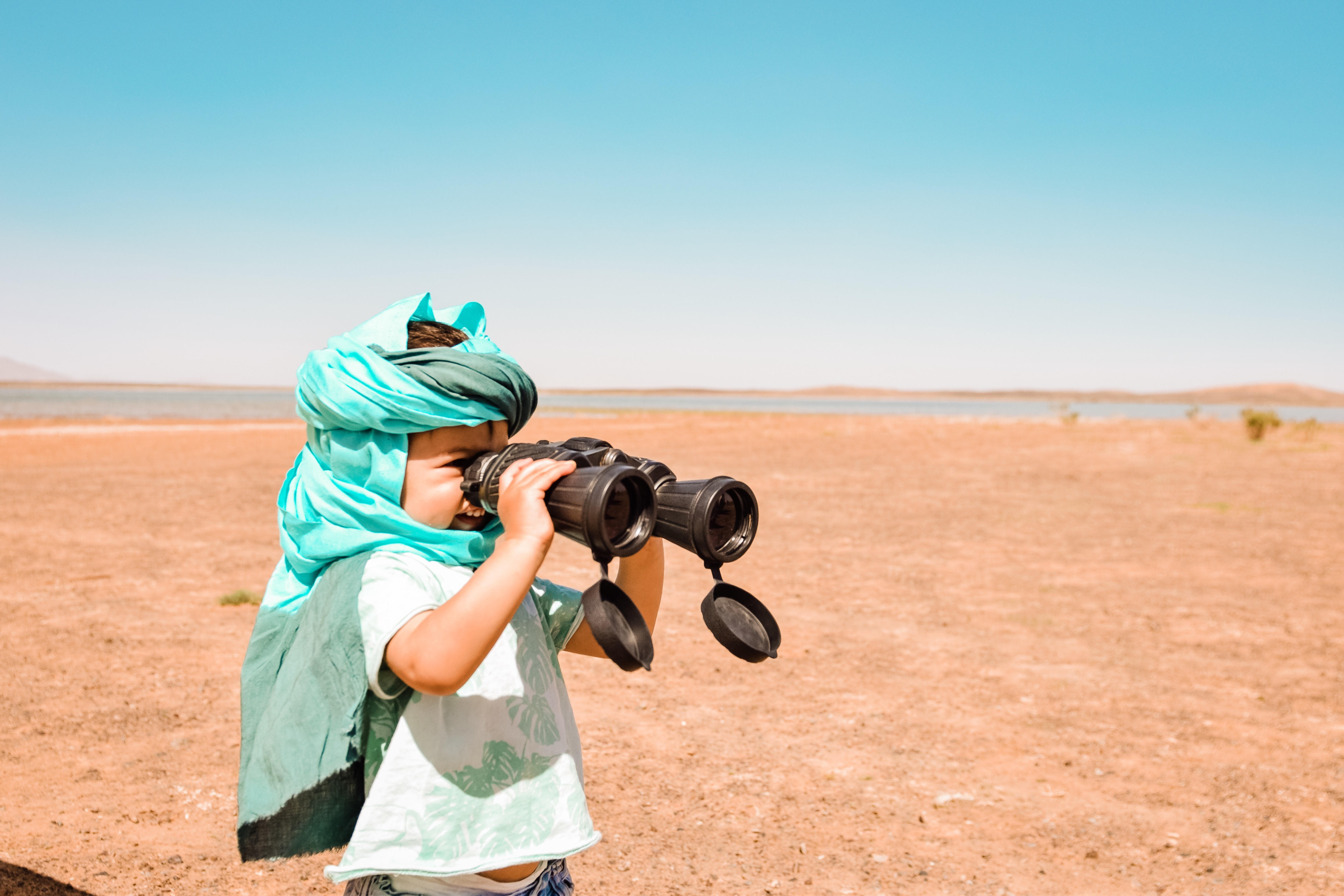 baby with binoculars morocco