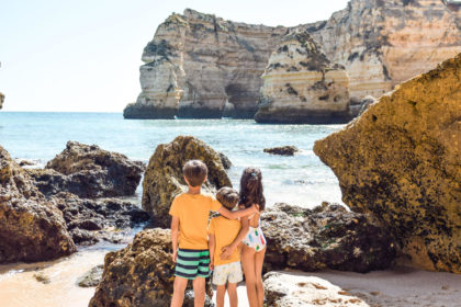 Simple Summer Service Ideas for Kids featured by top US family blog, Local Passport Family: image of kids at the beach