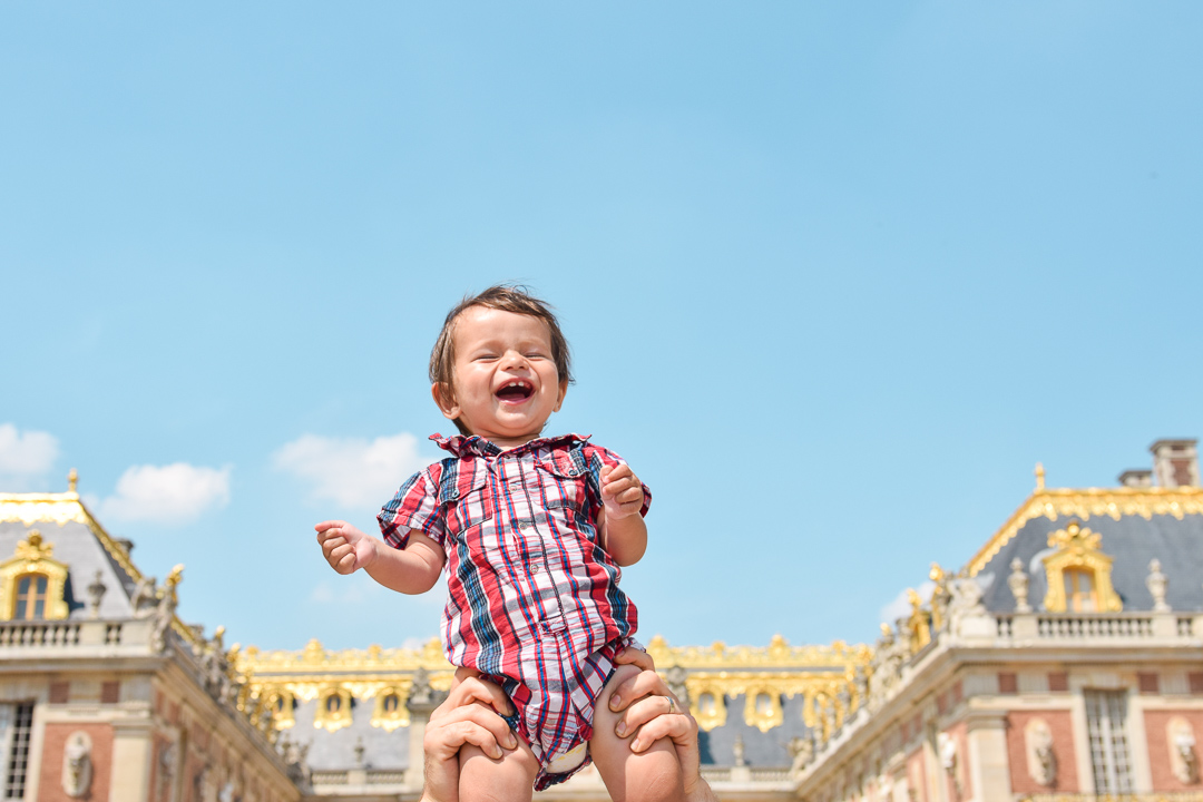  Best Things to Do In Paris With Kids featured by top US family travel blog, Local Passport Family: image of versailles with baby