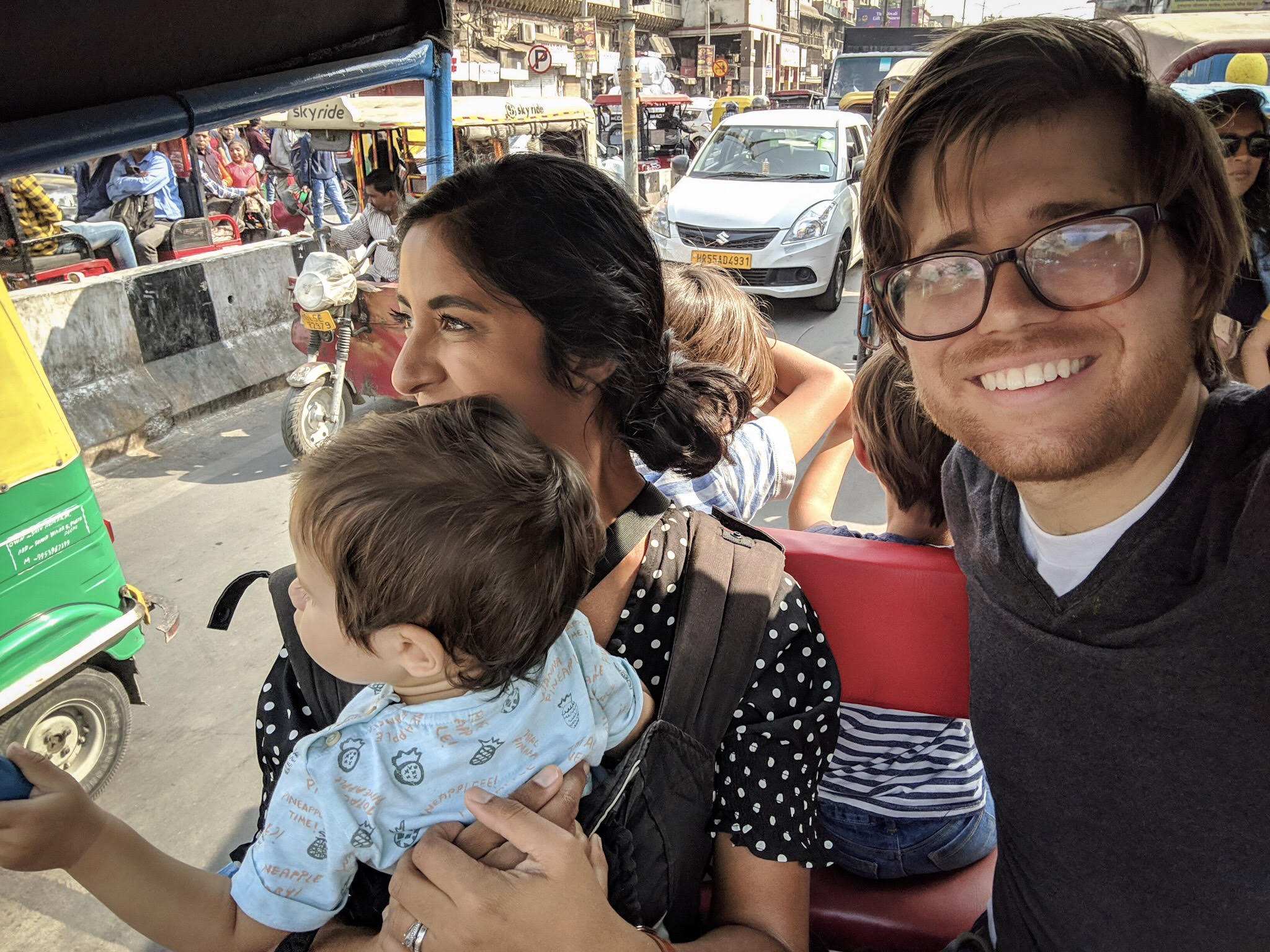 family riding rickshaw india